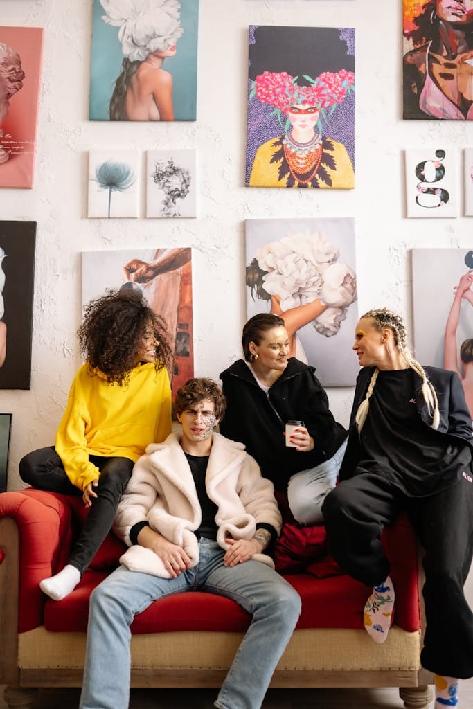 A lively group of friends enjoys time together in an art gallery setting.
