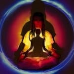 A woman in meditation surrounded by colorful auric light, creating a spiritual atmosphere.