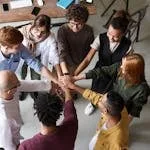 Top view of diverse group of people collaborating in office setting.